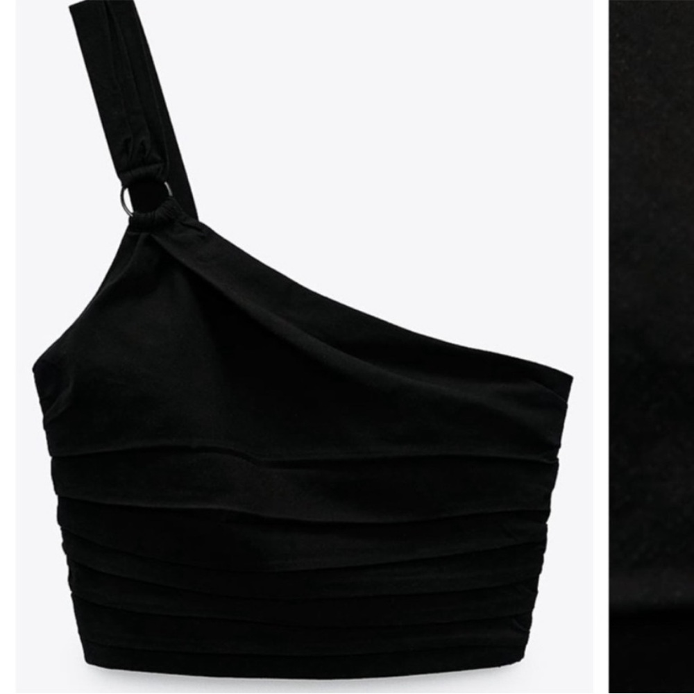 Black one shoulder top. Size medium brand new with tags attached.